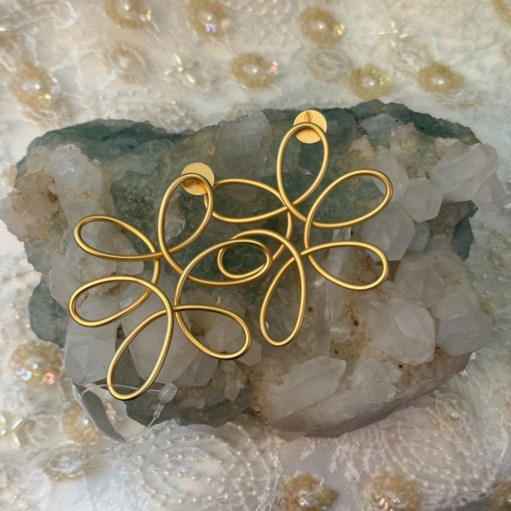 KHOI Dahl earrings.
